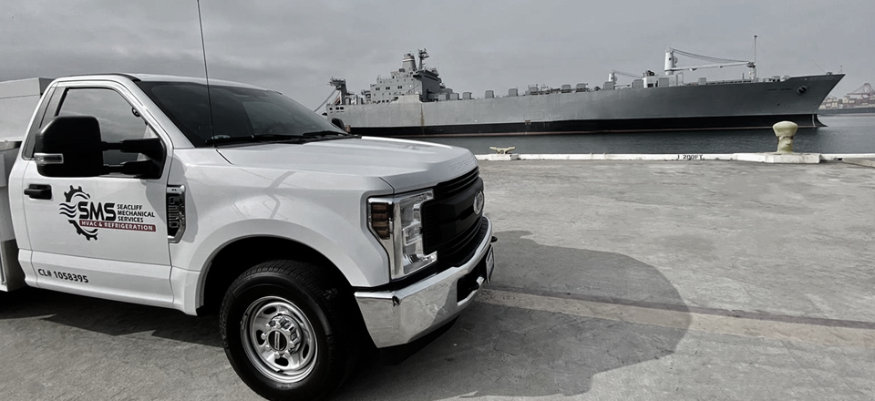 Seacliff service truck alongside a naval vessel
